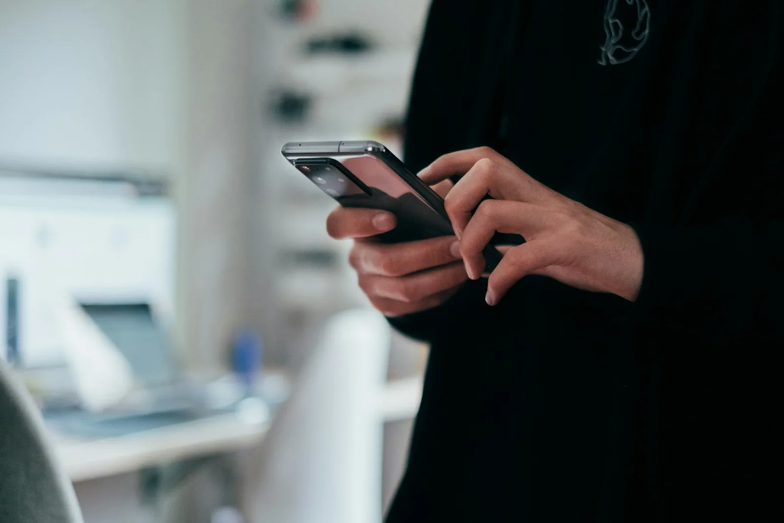 Person using a smartphone with both hands